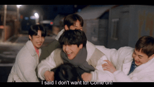 a group of young men hugging each other with the words i said i don t want to come on