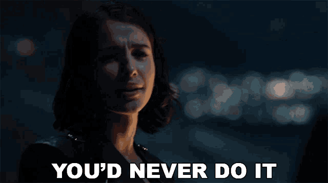a woman says " you 'd never do it " in front of a blurry background