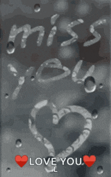 a drawing of a heart with the words " miss you " and " love you "