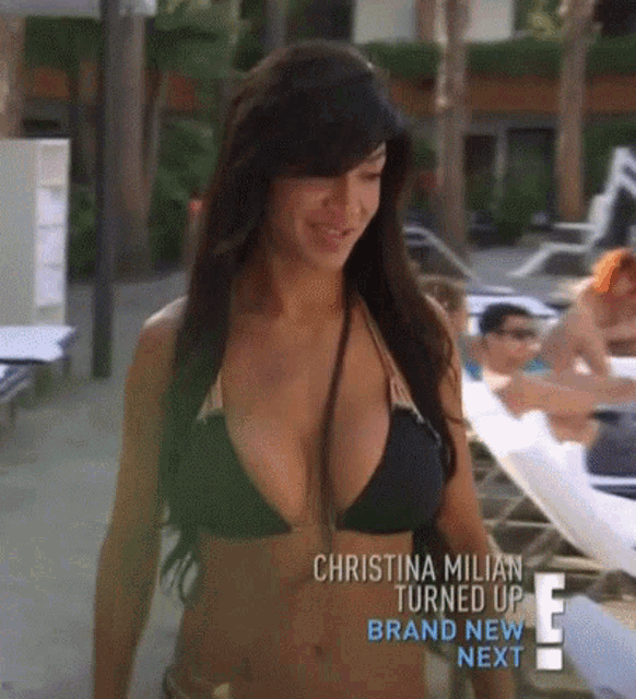 a woman in a black bikini is on a tv show