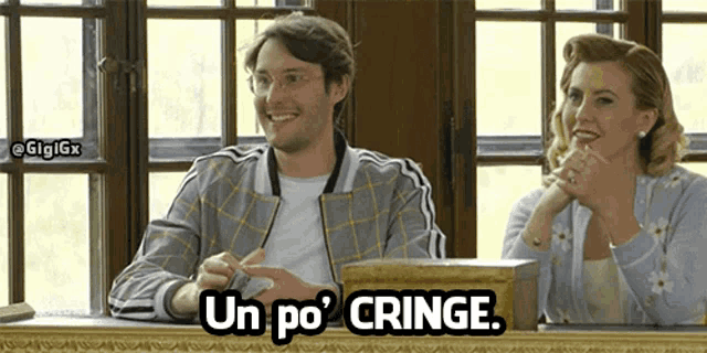 a man and a woman are sitting in front of a window and the man is smiling and the woman is saying un po cringe