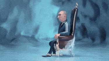 a man in a suit sits in a chair with the words " my heart is " on the bottom