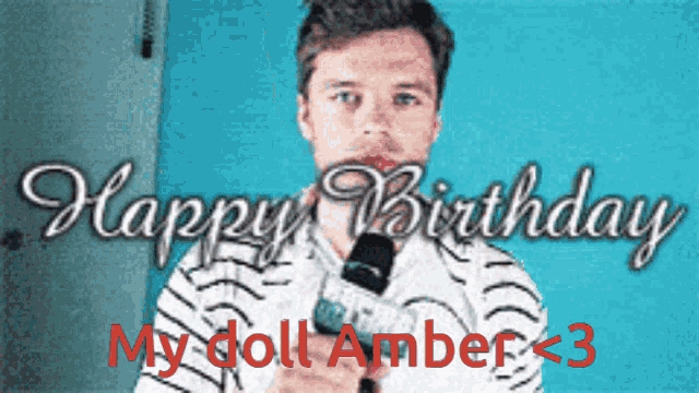 a man holding a microphone with the words happy birthday my doll amber < 3 on the bottom