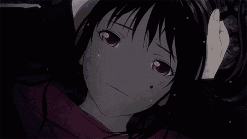 a close up of a girl with purple eyes and a red shirt