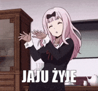 a girl with pink hair is standing in front of a cabinet with the words `` jaju zyje '' .