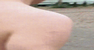 a close up of a person 's shoulder with a blurred background .