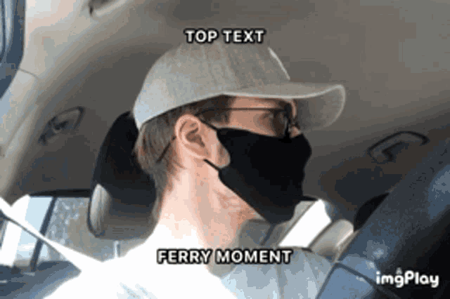 a man wearing a face mask and a hat is driving a car