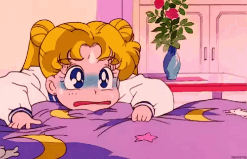 a cartoon of a girl laying on a blanket with a star on it