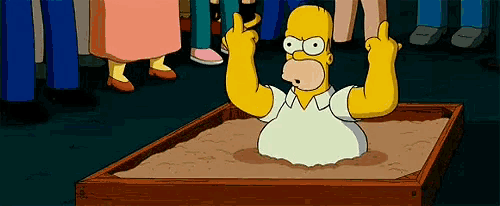 homer simpson is giving a thumbs up while sitting in a sandbox .