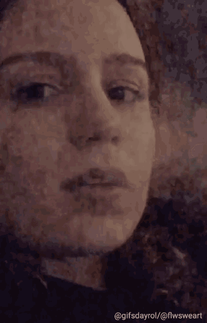 a close up of a woman 's face with the caption gifsdayrol