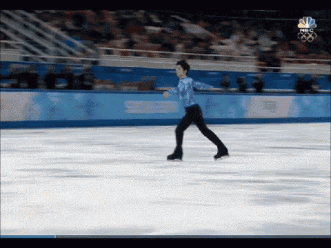 a man is ice skating on a rink with a nbc logo in the corner