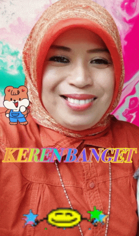 a woman wearing a hijab and a shirt with the word kerenbanget on it