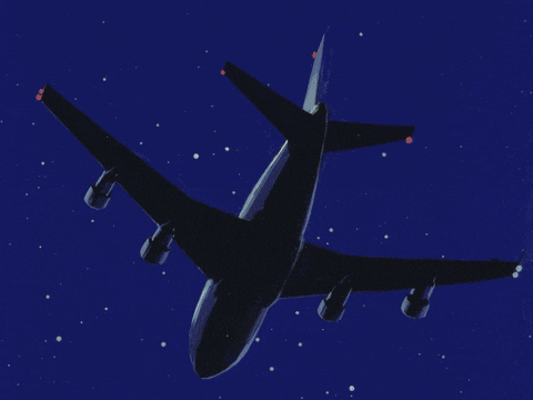 an airplane is flying through a dark blue sky with stars