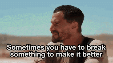 a man with a beard is laughing in the desert and says `` sometimes you have to break something to make it better '' .