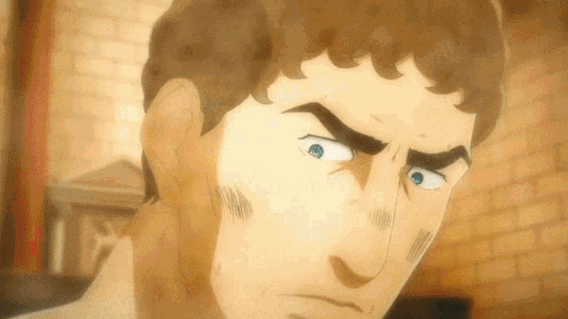 a close up of a man 's face with his eyes closed