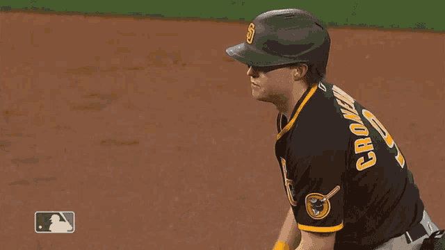 a san diego padres baseball player wearing a black and yellow uniform