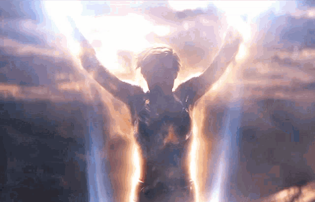 a woman with her arms outstretched is surrounded by a glowing light