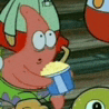 patrick star from spongebob squarepants is holding a cup of popcorn while sitting next to a turtle .