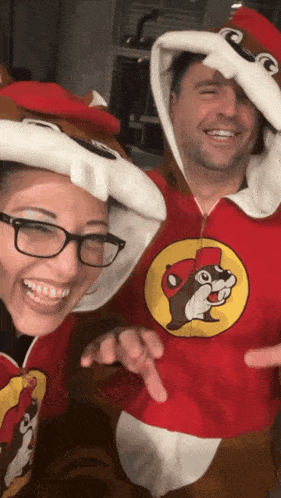 a man and a woman are dressed up as a squirrel