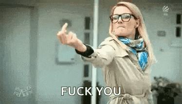 a woman wearing glasses is giving the middle finger and saying `` fuck you '' .