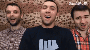 three men are standing next to each other in front of a leopard print background .