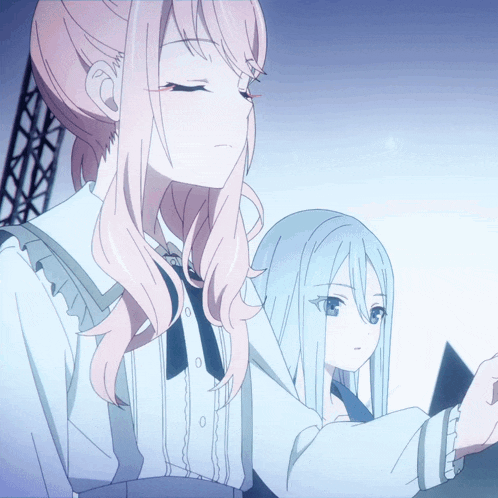 a girl with pink hair and a girl with blue hair