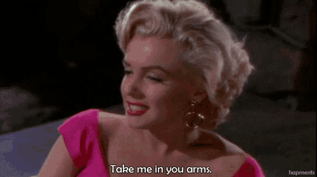 marilyn monroe says take me in your arms in a pink dress