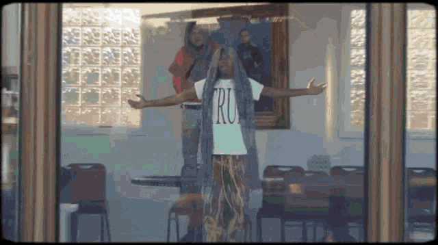 a person wearing a t-shirt that says ' ru ' on it