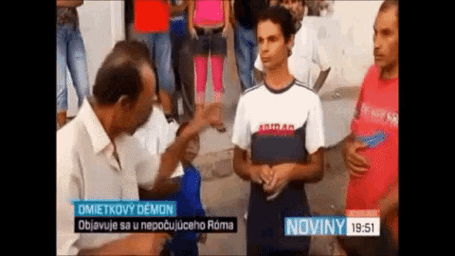 a group of people are standing in front of a sign that says noviny on it