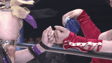 two women wrestling in a ring with the word stardom on the top