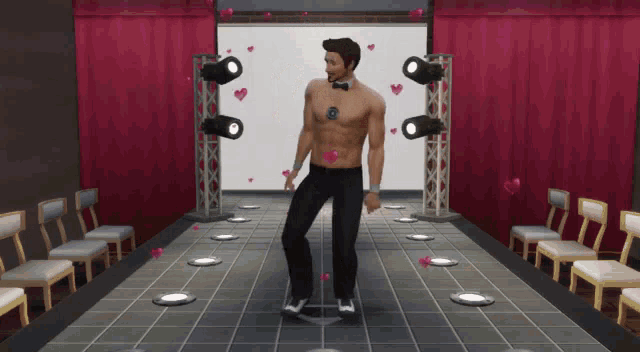 a man without a shirt is dancing on a stage