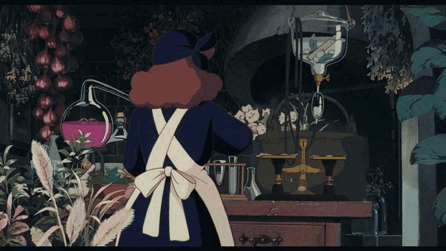a woman in an apron is standing in front of a table with a purple liquid in it