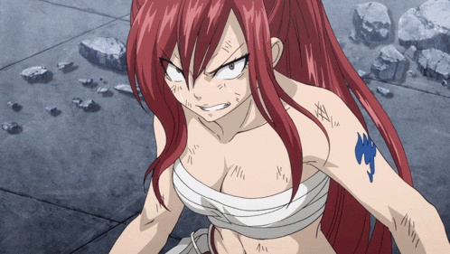 a woman with red hair and a tattoo on her arm