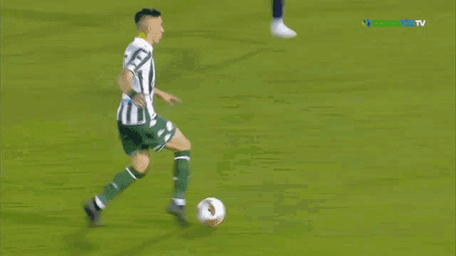 a soccer goal with a banner that says cosmote tv