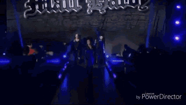 a group of people are standing in front of a crowd in a video taken by power director