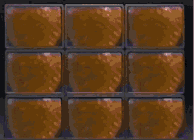 a row of blue boxes with a few pieces of candy in them