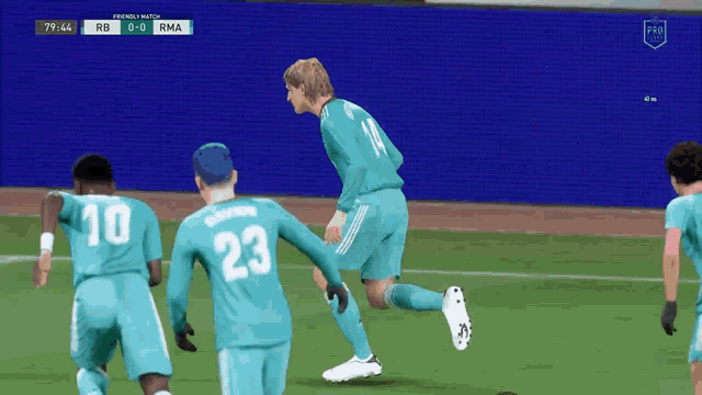 a soccer player with the number 23 on his back is kicking the ball