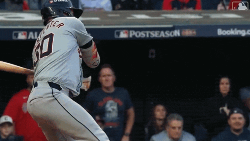 a baseball player with the number 30 on his jersey is swinging his bat