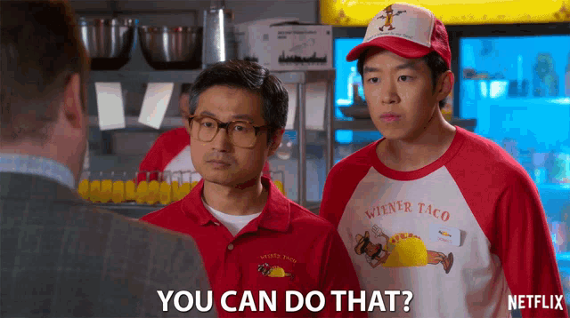 a man wearing a wiener taco shirt is asking if he can do that