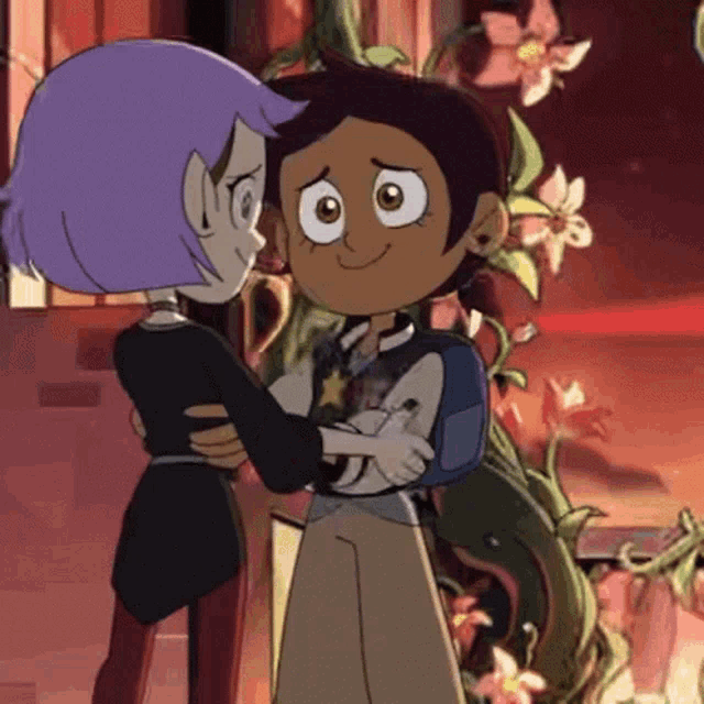 a couple of cartoon characters are hugging each other in front of some flowers .