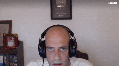 a man wearing headphones with a luma logo on the bottom right