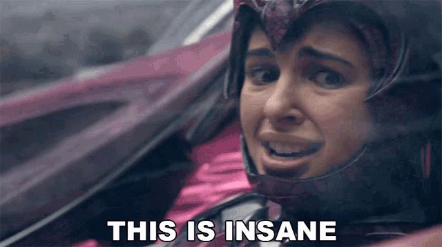 a woman in a helmet says " this is insane " in front of her face