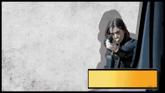 a woman holding a gun with a yellow border that says mfa on it