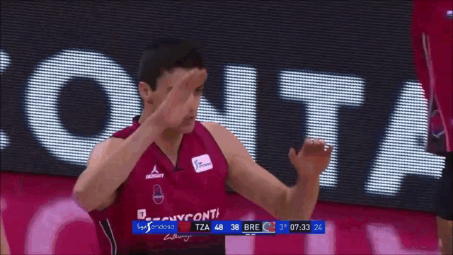 a basketball player with the name alocen on the back of his shirt