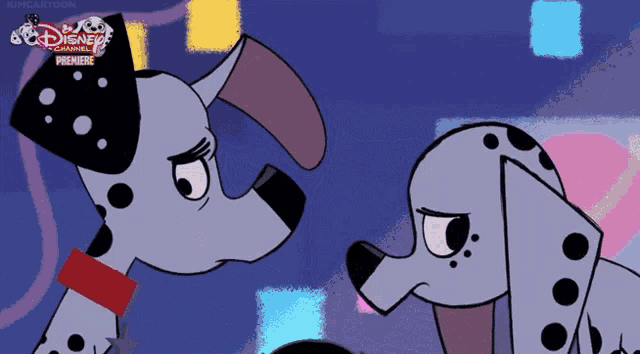 two dalmatian dogs are standing next to each other with a disney channel premiere advertisement in the background