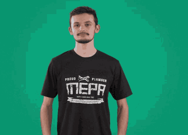 a man in a proud plumber mepa shirt holds a roll of tape