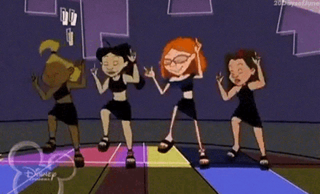 a group of girls are dancing on a dance floor .