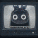 a black and white image of a stuffed animal with a bow on its head on a television screen .