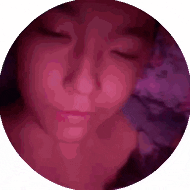 a close up of a woman 's face with her eyes closed