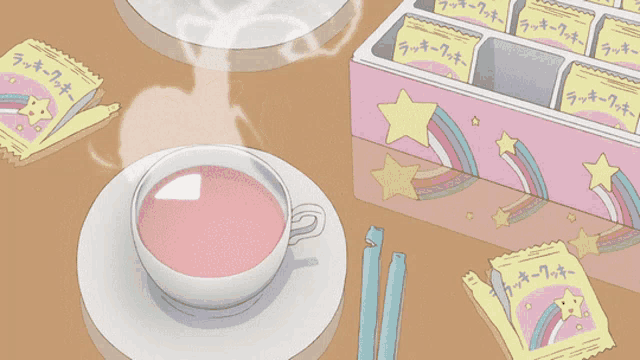 a cup of pink tea next to a box of lucky cookies